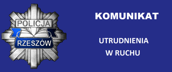 Na zdjęciu policyjna blacha i napis komunikat utrudnienia w ruchu.