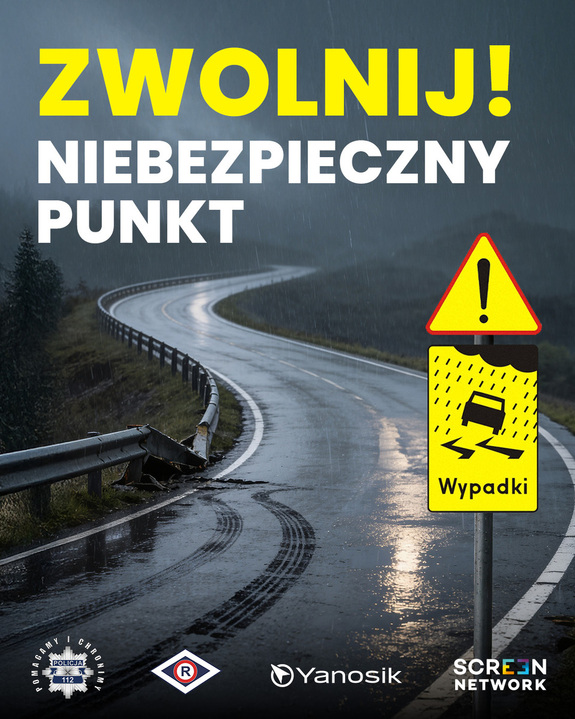 Na zdjeciu droga z zakrętem i napis zwolnij niebezpieczny punkt.